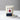 Lucette+Mo Celebration Candle – gathering inspired luxury candle with poinsettia artwork shown with matches