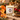 JOYEUX NOËL 11 oz candle lit with spiced orange peel, fir and clove