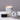 Lucette+Mo Adrift 2oz Travel Candle – fresh coastal tin candle with lemon, sea salt, and thyme shown with matches