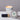 Lucette+Mo Hideaway 2oz Travel Candle – tropical travel candle with vanilla, cardamom, and citrus shown with matches