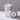 Lucette+Mo Escape 6oz Travel Candle – citrus and sea-inspired tin candle with grapefruit, tea, and salt
