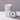 Lucette+Mo Daydream 6oz Travel Candle – soft floral candle tin with marigold, vanilla, and cedar