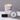 Lucette+Mo Adrift 6oz Travel Candle – coastal tin candle with sea salt, lemon, and thyme shown with matches