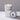 Lucette+Mo Stargazing 6oz Travel Candle – warm night-sky inspired tin candle with rum, vanilla, and currant